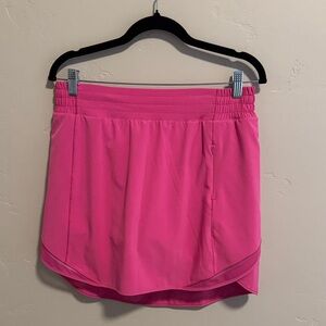 Lululemon pink active wear skirt with attached spandex shorts. Size 10. EUC